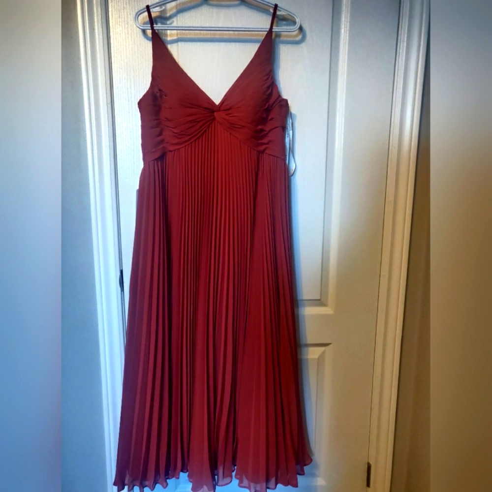 New and never worn. Ended up wearing a different dress as a bridesmaid